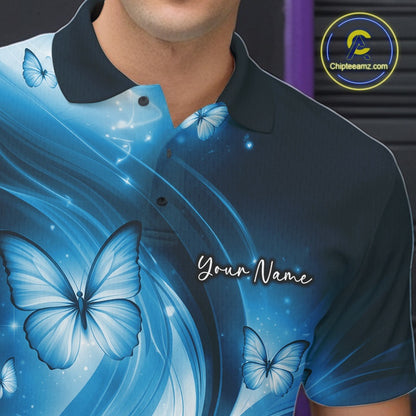 Left chest detail of a blue bowling polo featuring a bowling ball and butterfly-themed illustration.