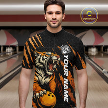 Load image into Gallery viewer, Male model wearing a black and yellow bowling quarter-zip shirt in a bowling lane, showcasing a roaring tiger holding a yellow bowling ball with orange claw-stripe graphics and a geometric background pattern.