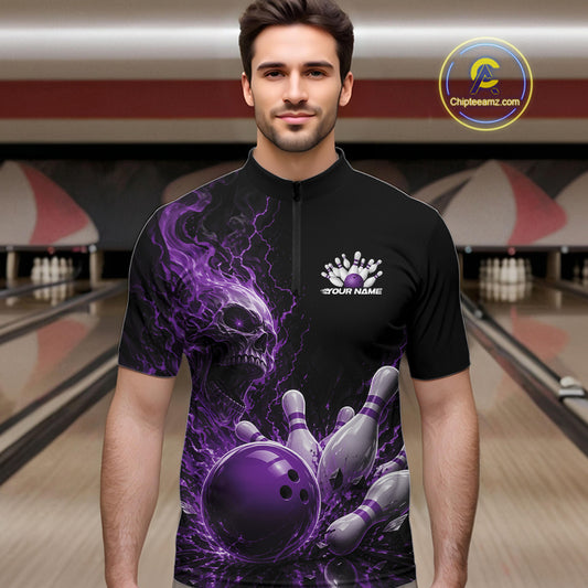 Front view of a male model in a bowling alley wearing a black quarter zip bowling shirt with a purple flaming skull, lightning, bowling pins, and a custom name.
