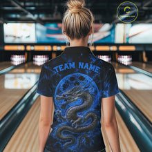 Load image into Gallery viewer, Back view of a female model in a bowling alley wearing a blue custom quarter-zip bowling shirt featuring an ancient dragon, flames, and a moon-inspired bowling ball design.