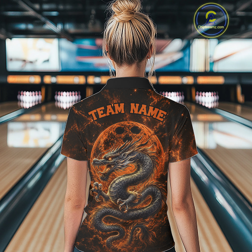 Back view of a female model in a bowling alley wearing an orange custom bowling polo shirt featuring an ancient dragon, flames, and a moon-inspired bowling ball design.