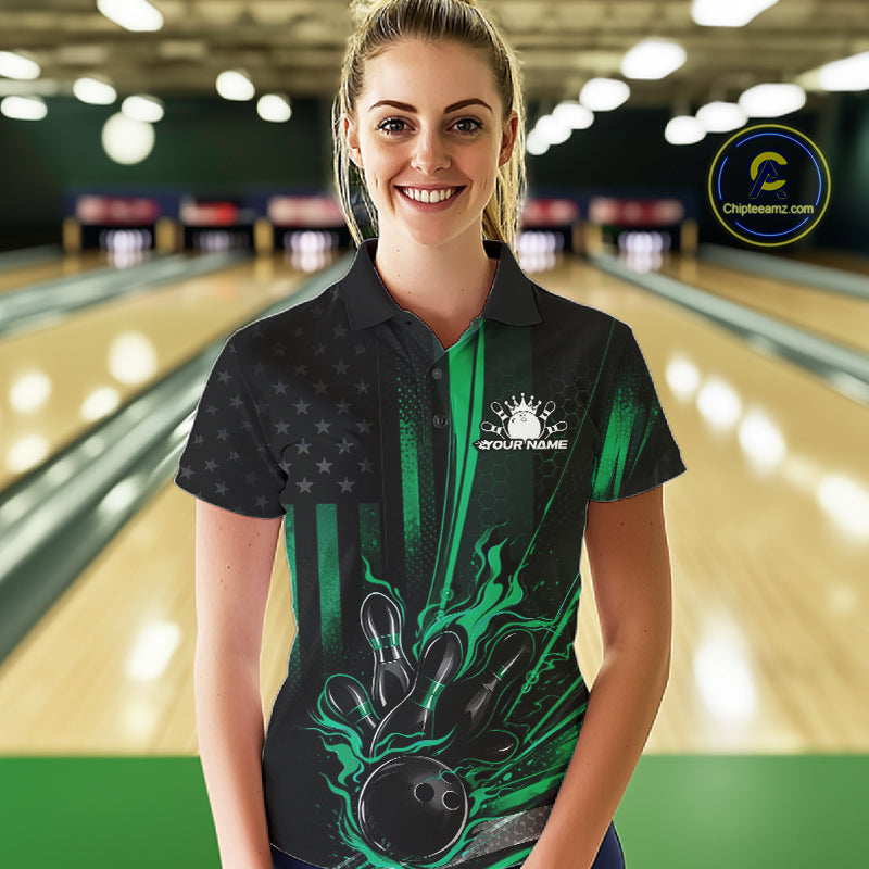 Female model wearing a black and green bowling polo shirt at a bowling lane showcasing patriotic bowling strike artwork with distressed flag styling.