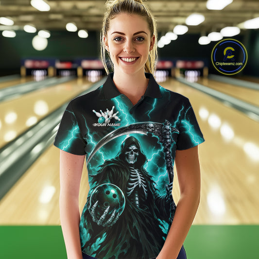 A woman wearing a custom short-sleeve polo shirt with a Grim Reaper bowling graphic, standing in a bowling alley. The shirt features a black and dark teal design with lightning, a skeleton, and a bowling ball, with a white custom name printed on the chest.