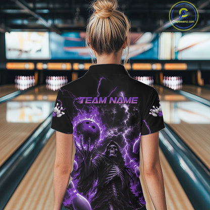 A woman viewed from behind wearing a black short-sleeve bowling shirt with a purple and black Grim Reaper graphic and the text 'TEAM NAME' on the back, standing in a bowling alley.