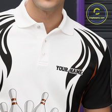 Load image into Gallery viewer, Close-up left chest detail of a white, black, and orange bowling polo shirt with bowling ball and pins graphics.