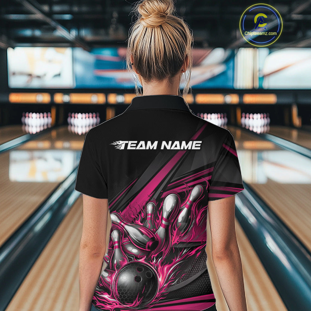 Female model in a bowling alley, back view of black polo shirt featuring hot pink flame bowling ball and abstract geometric stripe artwork