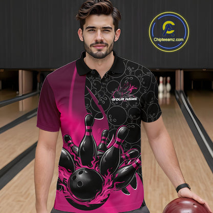 Front view of a male model in a bowling lane wearing a black and pink polo shirt with flaming black bowling ball striking pins and dynamic bowling graphics.