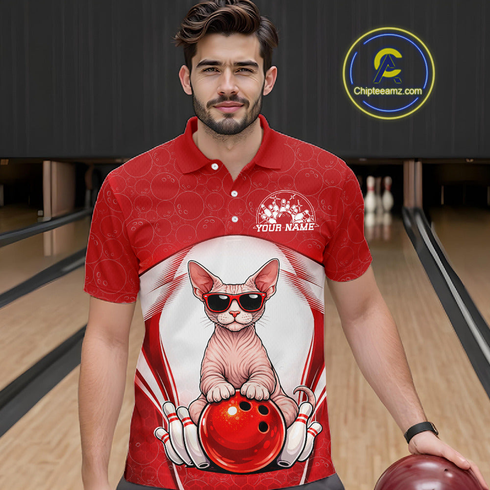 Male model at a bowling lane wearing a bowling polo shirt with a sphynx cat in sunglasses resting against a bowling ball.