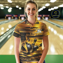 Load image into Gallery viewer, Front view of a female model wearing a bowling polo shirt featuring glossy gold and black bowling ball and pins artwork at a bowling lane.
