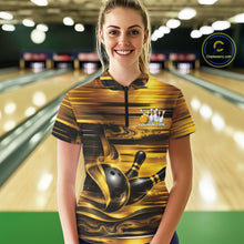 Load image into Gallery viewer, Front view of a female model inside a bowling center wearing a bowling quarter-zip shirt featuring glossy gold and black bowling ball and pins artwork.