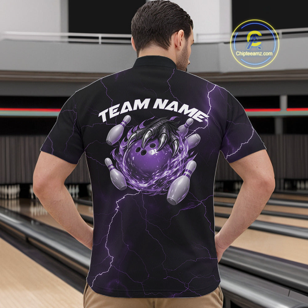 Front view of a black and purple mens bowling quarter-zip displaying a flaming bowling ball held by a dragon claw.