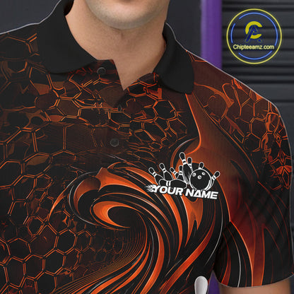Close-up of the left chest on a black and orange bowling polo shirt featuring a tribal flame bowling ball and pins graphic