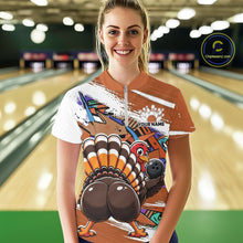 Load image into Gallery viewer, Front view of a happy female model in a bowling alley wearing an orange custom quarter zip bowling shirt with a funny graffiti turkey holding a bowling ball, paint splatter accents, and a personalized name.
