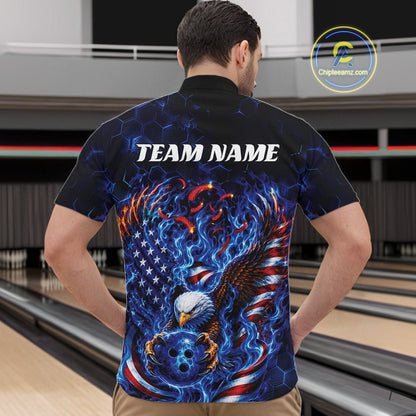 Front view male model in a bowling lane wearing a quarter zip shirt with flaming eagle graphics, blue bowling ball, American flag, and blue flames.