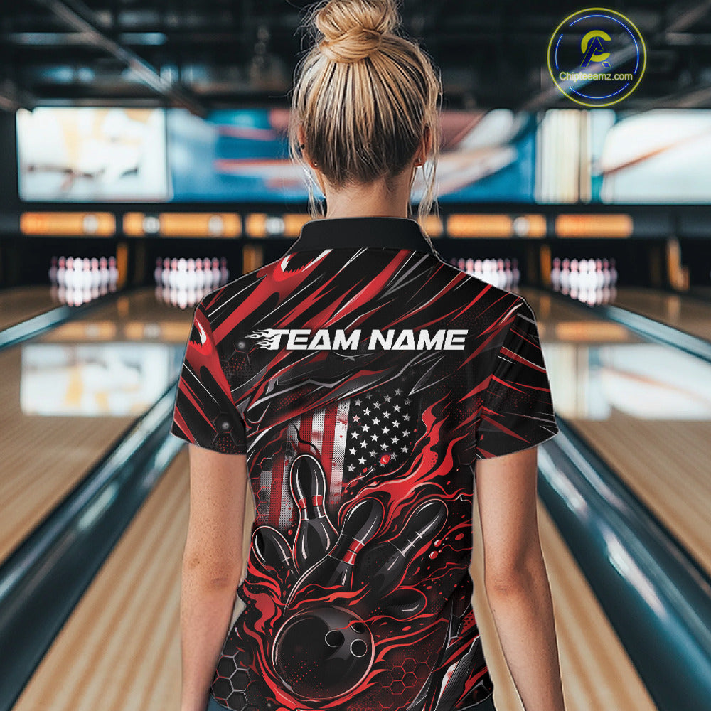 Female model at a bowling lane, back view of black and red quarter zip shirt featuring patriotic flames bowling ball striking pins with flag-inspired styling