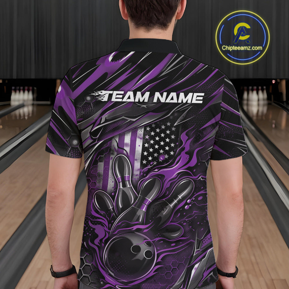 Back view of a male model in a bowling venue wearing a black and purple polo shirt showcasing a flaming bowling ball and patriotic pin motif.