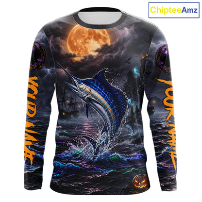 A long-sleeve crewneck shirt with an all-over Halloween-themed graphic print featuring a jumping blue marlin under a full moon, dark stormy seas, and orange text on the sleeves, shown on a white background with a ChipteeAmz logo in the top right corner.