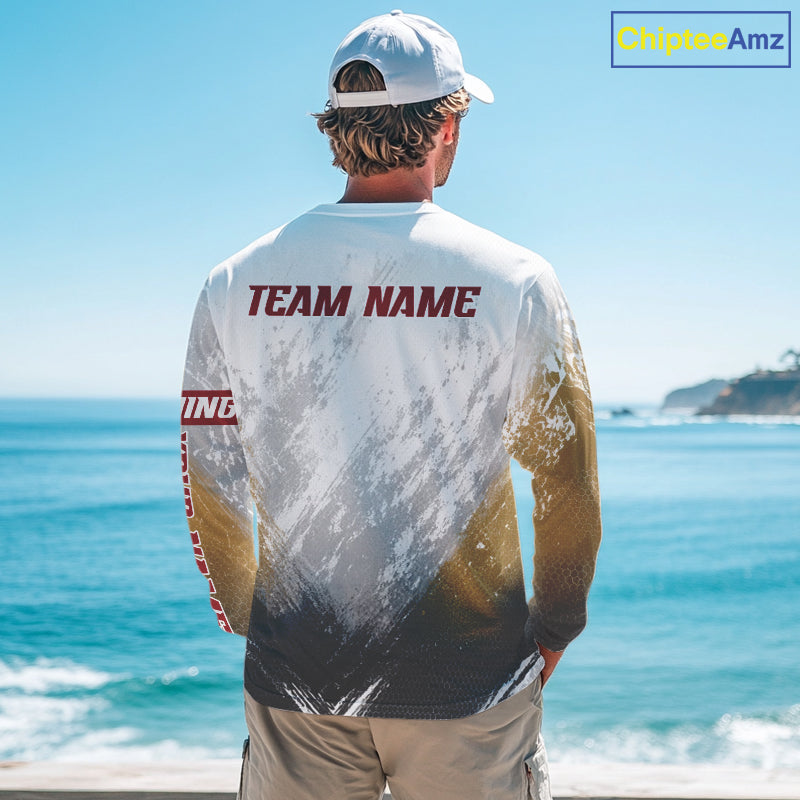 Person wearing a sports jersey with 'TEAM NAME' on the back, standing by the ocean.