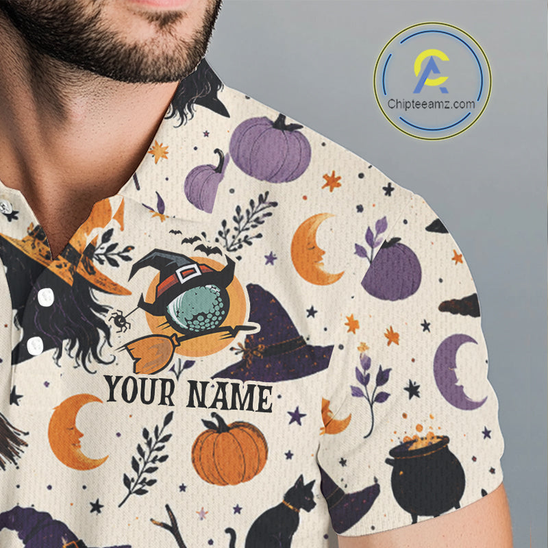A close-up of a man wearing a short-sleeve collared shirt with a Halloween-themed print featuring pumpkins, moons, stars, cauldrons, and a witch riding a broomstick. The shirt has a cream base with a multicolor graphic print and the text 'YOUR NAME' on the front.