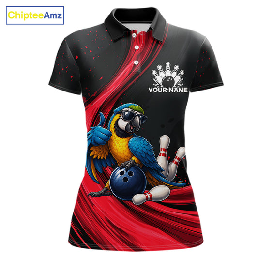 A women's short-sleeve polo shirt with a black collar and a vibrant graphic print featuring a blue and yellow parrot wearing sunglasses, bowling balls, and pins, set against red and black abstract streaks. The shirt includes a white bowling hand icon and the customizable text 'YOUR NAME' on the chest.