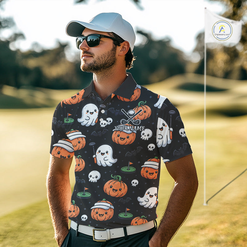 A man wearing a black short-sleeve polo shirt with a Halloween-themed print of pumpkins, ghosts, and skulls, standing on a golf course.
