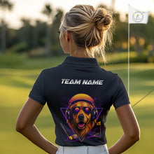 Load image into Gallery viewer, Person wearing a black polo shirt with a colorful dog design and 'Team Name' text on a golf course