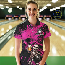 Load image into Gallery viewer, Person wearing a pink and black bowling shirt with a skeleton design in a bowling alley.