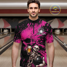 Load image into Gallery viewer, Man wearing a pink and black bowling shirt with a skeleton design in a bowling alley.