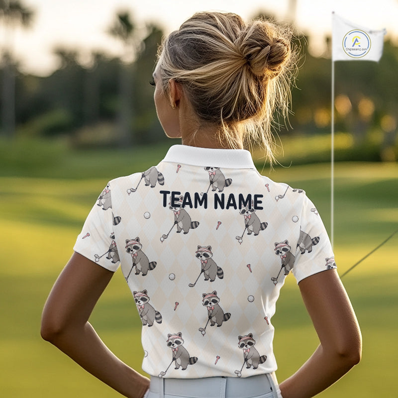 Person wearing a white polo shirt with raccoon patterns and 'TEAM NAME' text on a golf course.