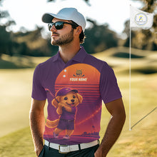 Load image into Gallery viewer, Man wearing a purple golf shirt with a dog graphic on a golf course