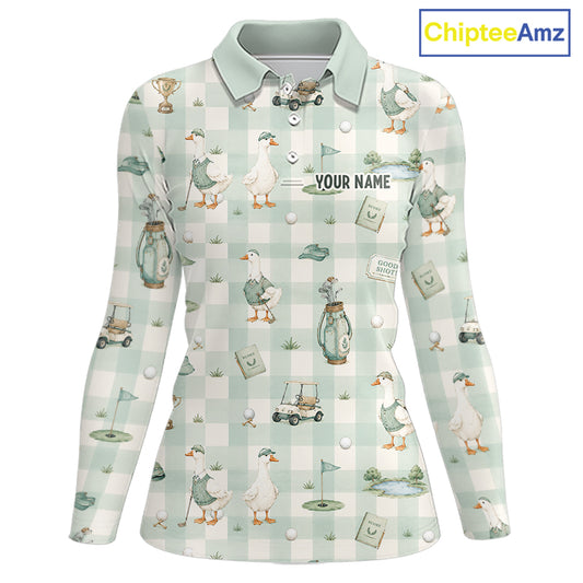 A long-sleeve collared polo shirt with a light mint green and white gingham pattern, decorated with a golf duck print featuring ducks, golf clubs, carts, and flags. The shirt includes a customizable name label on the chest and a 'GOOD GOLF' patch graphic.