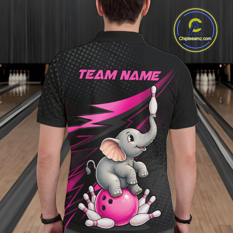 A person viewed from behind wearing a black short-sleeve bowling-themed shirt with a large graphic of a gray elephant sitting on a pink bowling ball, pink lightning bolts, and the text 'TEAM NAME' across the upper back. Bowling lanes are visible in the background, and a circular 'Chipteeamz.