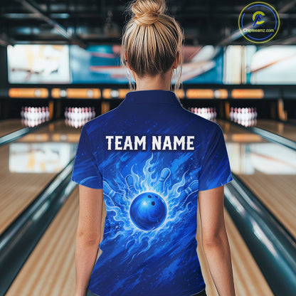 A woman viewed from behind wearing a blue short-sleeve polo shirt with a bowling-themed graphic and the text 'TEAM NAME' on the back, standing in a bowling alley.
