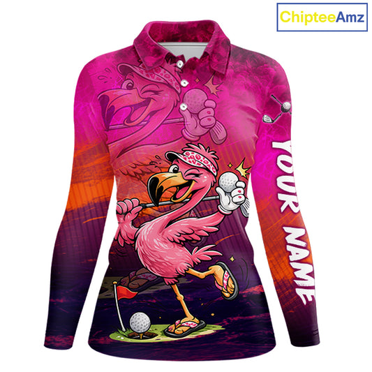 A long-sleeve collared polo shirt with a vibrant pink flamingo golf graphic, featuring a cartoon flamingo hole-in-one scene, a large flamingo face on the chest, and 'YOUR NAME' printed down the right sleeve. The shirt has a pink-to-purple gradient design with orange sunset accents.
