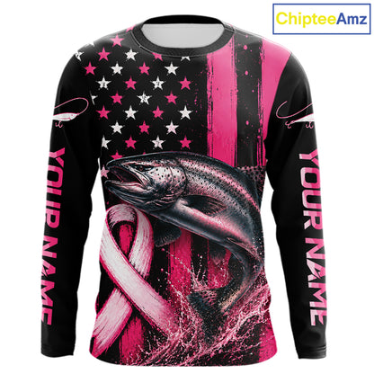 A long-sleeve black shirt with a pink and white patriotic fishing graphic, featuring a salmon, an American flag with stars, a pink ribbon, and 'YOUR NAME' printed down both sleeves. A 'ChipteeAmz' logo is visible in the top right corner.