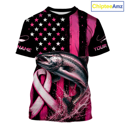 A short-sleeve graphic t-shirt featuring a pink and black American flag design with a large trout jumping over a pink ribbon, on a white background. The shirt has customizable text placeholders 'NAME' and 'YOUR' on the sleeves, and a 'ChipteeAmz' logo in the top right corner.
