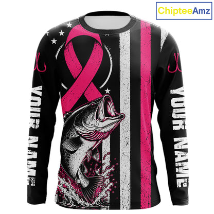 A long-sleeve black graphic shirt featuring a pink awareness ribbon, a fish illustration, distressed white and pink vertical stripes, and 'YOUR NAME' printed down both sleeves. A 'ChipteeAmz' logo is visible in the top right corner.