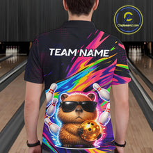 Load image into Gallery viewer, Person wearing a colorful bowling shirt with a capybara holding a bowling ball and text 'TEAM NAME' in a bowling alley.
