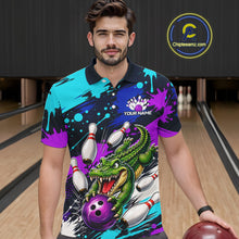 Load image into Gallery viewer, Man wearing a colorful polo shirt with a dinasour and bowling design in a bowling alley.