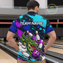 Load image into Gallery viewer, Person wearing a colorful bowling-themed shirt with a alligator design in a bowling alley.