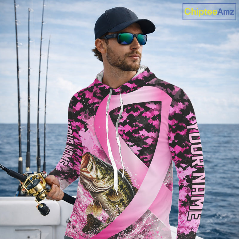 Angler wearing pink ribbon camouflage bass fishing breast cancer long sleeve sun protection shirt on the water