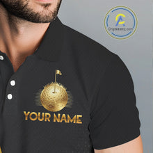 Load image into Gallery viewer, Closse-up fabric of black polo shirt with gold golf ball design and 'Your Name' text on the chest