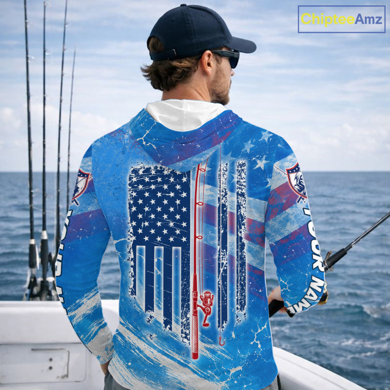 Man on a boat wearing a blue American flag long sleeve hooded fishing shirt 