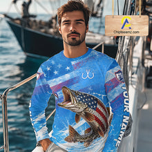 Load image into Gallery viewer, Man wearing a blue patriotic northern pike fishing shirt with custom name, standing on a boat