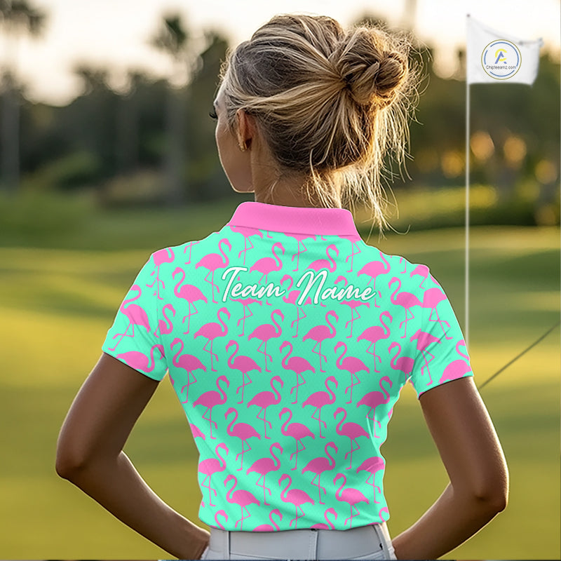 Woman wearing a green polo shirt with pink flamingo pattern and 'Team Name' text on the back, standing on a golf course.