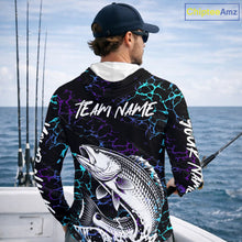 Load image into Gallery viewer, Angler wearing Redfish Fishing neon blue long sleeve hooded saltwater fishing shirt on the boat with custom team name on the back