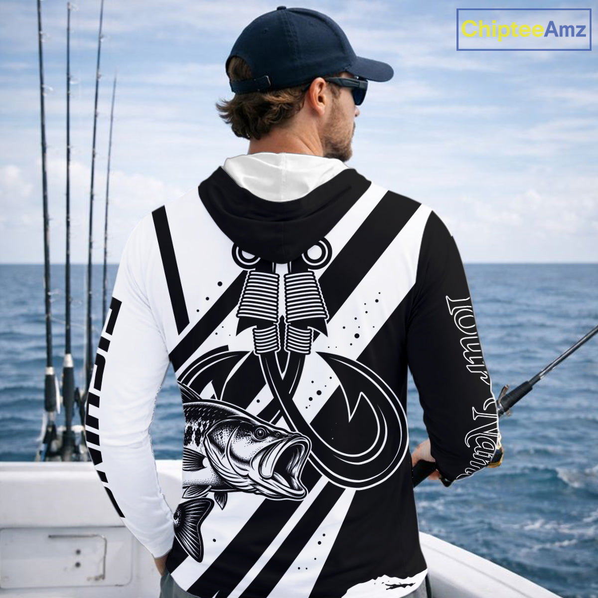Angler wearing black and white largemouth bass long sleeve hooded fishing shirt with custom name on sleeve