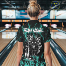 Load image into Gallery viewer, Back view of woman wearing a turquoise flaming panther bowling polo shirt inside a bowling alley.