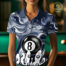 Load image into Gallery viewer, Woman wearing a blue marble swirl 8 ball billiard jersey beside a pool table front view.