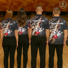 Load image into Gallery viewer, Back view of bowling team wearing matching patriotic bowling shirts in a bowling alley.